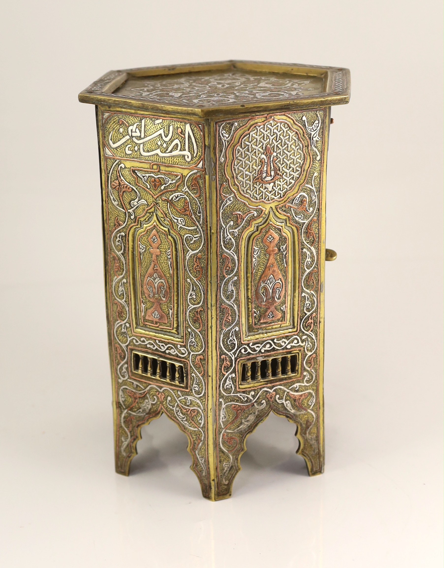 A Cairo ware silver and copper inlaid brass Qur’an stand, early 20th century